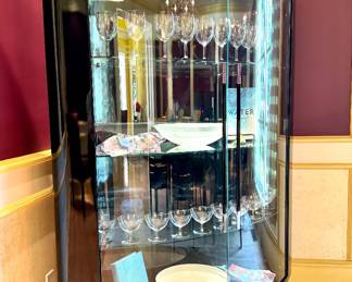 $2,500 - Contemporary Curved Glass Display Cabinet w/ glossy haguer black finish and stiletto metal legs - 50" x 18" x 57"