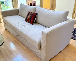 $850. Crate and Barrel slip covered sofa. Single seate, removable back cushions. 84 x 36 x 36.