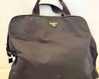 $150. Prada, very well loved, nylon bag. 14” L x 12H