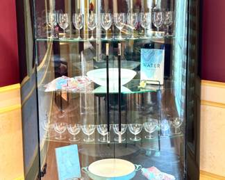 $2,500 - Contemporary Curved Glass Display Cabinet w/ glossy haguer black finish and stiletto metal legs - 50" x 18" x 57"