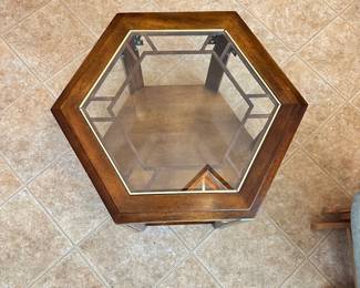 #013		Vintage Campaign-style hexagonal side table with glass top and brass fretwork detailing and 1 shelf. watermark on bottom shelf (shown in photo) 23-26” w x20”h	 $ 60.00 																						