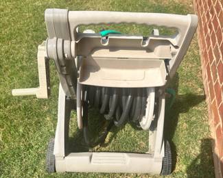 #021		Suncast Hose Reel Cart w Hose. Good preowned condition Works great but has some wear (shown in pictures)	 $ 18.00 																						