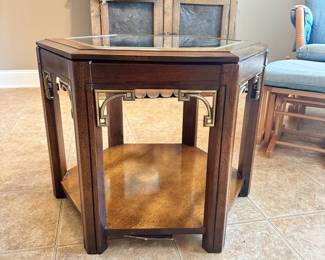 #013		Vintage Campaign-style hexagonal side table with glass top and brass fretwork detailing and 1 shelf. watermark on bottom shelf (shown in photo) 23-26” w x20”h	 $ 60.00 																						