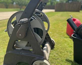 #002		Ames Hose Wheel Cart w Hose	 $ 25.00 																						