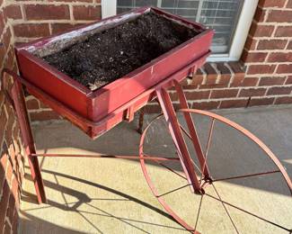 #017		Red Rustic “Fruit Pickers Cart” Garden Planter/Potting Cart w Large Metal Wheel Planter box 24” w x 12” d, Wheel 22.5” round, Overall height 28.5”	 $ 65.00 																						