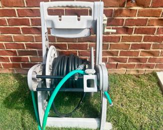 #021		Suncast Hose Reel Cart w Hose. Good preowned condition Works great but has some wear (shown in pictures)	 $ 18.00 																						