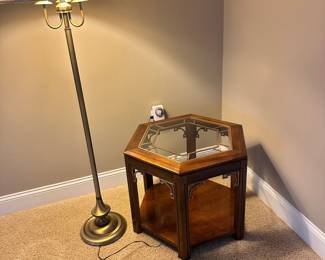 #013		Vintage Campaign-style hexagonal side table with glass top and brass fretwork detailing and 1 shelf. watermark on bottom shelf (shown in photo) 23-26” w x20”h	 $ 60.00 																						