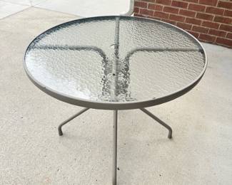 #009		Round Glass Top Patio Table w Metal Base 36”. As is finish on frame	 $ 32.00 																						