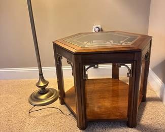 #013		Vintage Campaign-style hexagonal side table with glass top and brass fretwork detailing and 1 shelf. watermark on bottom shelf (shown in photo) 23-26” w x20”h	 $ 60.00 																						