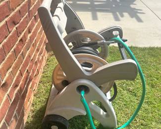 #021		Suncast Hose Reel Cart w Hose. Good preowned condition Works great but has some wear (shown in pictures)	 $ 18.00 																						