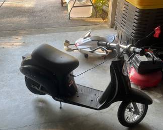 Scooter with power cord and 2 new batteries 