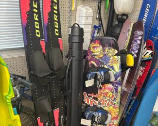 Lots of waterskis, downhills skis and wakeboards