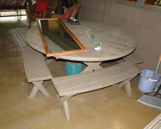 Round Picnic table with benches kept inside