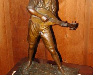 Bronze boy playing lute