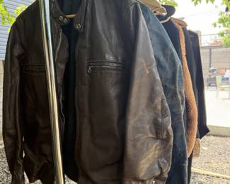 multiple racks of mens vintage shirts, jackets, suits and tshirts