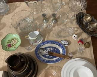 Various glassware including a clear round pitcher, silver mint julep glasses and a large cast iron cooker with lid, and a large copper bowl. 