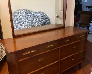 Part of a bedroom set that includes a large bureau and dresser with mirror.  Made by Dixie Furniture Company. 