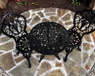 cast iron patio chairs and table