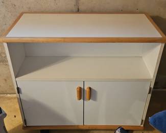 White cabinet with wood trim