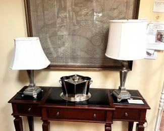 Six legged table, lamps and wall art.
