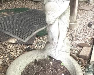 Concrete statue and planter.