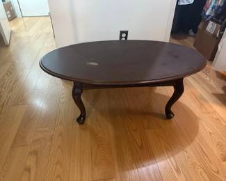 Vintage Chippendale Style Cherry Wood Oval Coffee Table featuring classic cabriole legs and traditional ball-and-claw feet. While it shows some surface wear, this style is highly sought after by DIY furniture flippers who love to sand down and refinish solid wood pieces