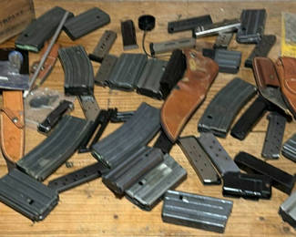 Lot 37: Assorted firearm magazines, holsters, and ammo box