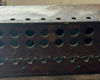 Lot 114: Vintage wooden bottle rack with circular slots and drawers