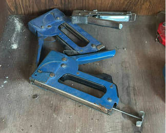 Lot 125: Blue and red handheld staple guns