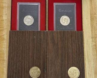 Lot 54: 2 Eisenhower dollar coins in display boxes