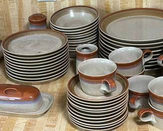 Lot 156: Stoneware dinnerware set with plates, bowls, and mugs