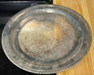 Lot 158: Round engraved metal tray and three-lobed shell-shaped serving platter