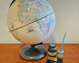 Lot #134 - Vintage Metal Globe with Twisted Glass Dip Pen, Two Small Glass Ink Bottles and Antique Crayons