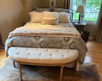 Queen Iron bed with newer mattress, fur rug.