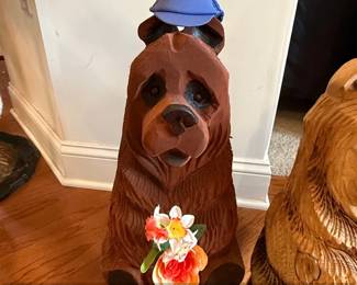 Chainsaw Carved Sitting Bear with Flowers and Blue Cap