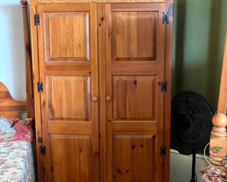 Armoire with shelves and drawers