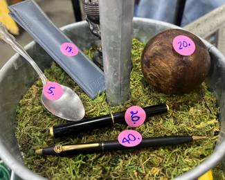 Antique pens, silver spoons, bowing ball