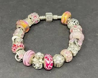 Silver Tone Beaded Bracelet 18 Decorative Charms in Shades of Pink and Lavender Maker Unknown
