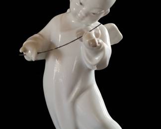 Porcelain Figurine of a Child Playing a Stringed Instrument
