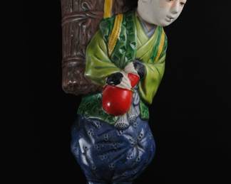 Japanese Ceramic Figure of a Boy Carrying a Basket