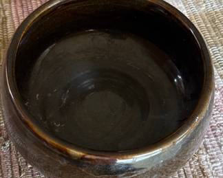 pottery bowl with deep brown glaze 