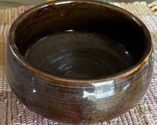 pottery bowl with deep brown glaze 