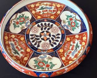 Vintage Japanese Imari plate decorated with 6 alternating landscape and foliate panels in traditional red and blue colors