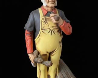 Ceramic Figurine of a Fisherman Smoking a Pipe