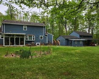 Back of house. Will add better house pics later. 3br, 2.5 bath, 10 private acres, huge garage with loft.