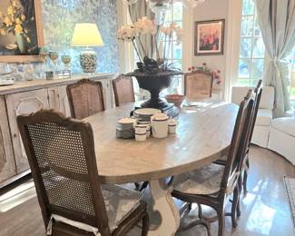 Welcome to 6625 Westchester in the prestigious West University! We offer this elegant dining table surrounded by 6 vintage chairs