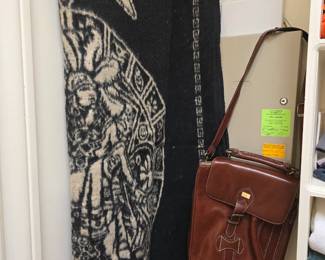 oversized poncho and man's leather shoulder bag
