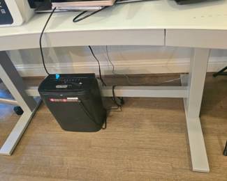 Tresanti white glass-topped adjustable height sit/stand tech desk with curved design