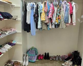 closets full of kid's clothes and shoes