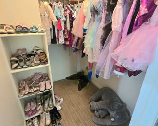 closets full of kid's clothes and shoes